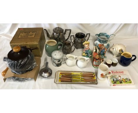 A mixed lot to include a unused brown 1.9 litre enameled Fondue set with 6 forks, silver plated teapot, sugar bowl and milk j