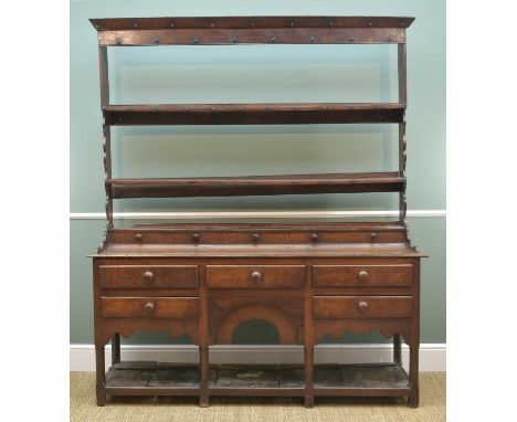 GEORGE III OAK WELSH DRESSER, angled cornice to the open rack with shaped lower sides, above row of false spice drawers, open