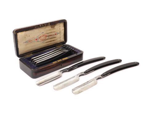 A cased set of Victorian seven-day razors by Wilkinson,19th century, retailed by Wade &amp; Butcher of Sheffield, each razor 