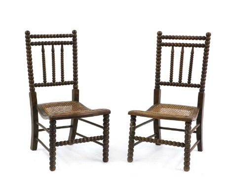 A pair of oak bobbin chairs,19th century, 40cm wide51cm deep79cm high, seat 34cm highCondition ReportOne example with a break