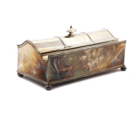 A silver plated desk stand,the domed top with final and beaded borders, opening to reveal two glass ink wells, raised on four