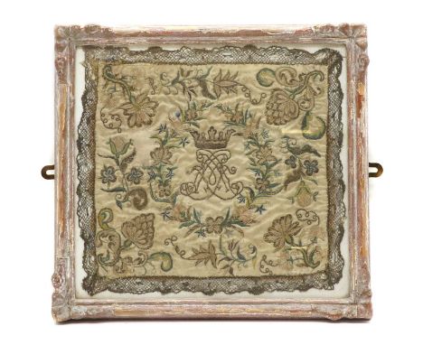 A silk needlework handkerchief,18th/19th century, the floral and foliate design worked in multicoloured silks on a pale groun