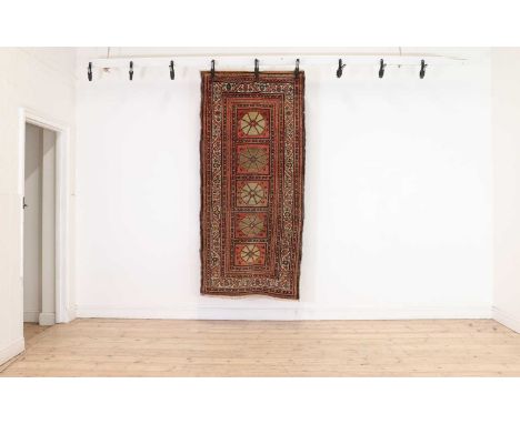 A Hamadan runner,c.1900, the brick ground with five main panels within multiple borders206 x 98cmCondition ReportFaded with o