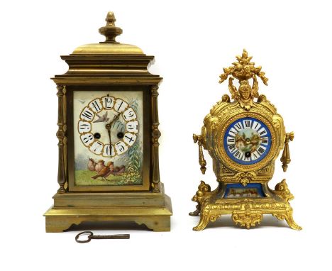 A late Victorian brass mantel clock,the two train movement striking on a gong, the case with painted pottery panels depicting