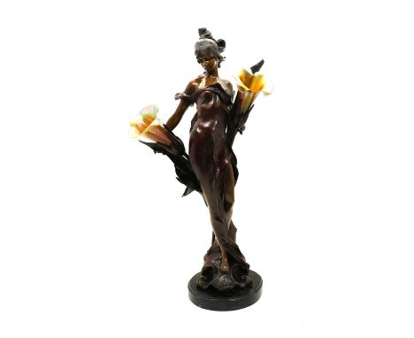 An Art Nouveau style spelter table lampof recent manufacture, modelled as a semi-clad lady with two Lundberg Studios iridesce