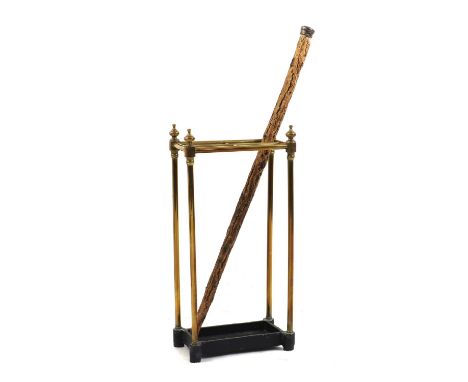 A brass stick stand, c.1900, of four divisions with turned finials and a cast iron weighted base31cm wide18cm deep62cm highan