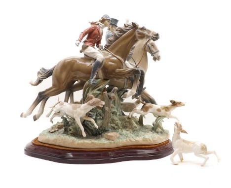A Lladro porcelain group,'The Hunt', printed marks,47cm wide61cm highCondition ReportOne dog detached and with losses. The gl