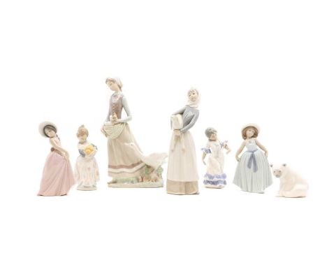 A collection of Lladro porcelain figures 20th century, to include a girl holding a lamb 28cm high, a Flamenco Dancer 16cm hig