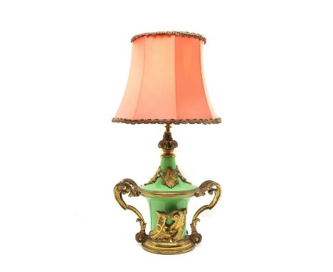 A French ormolu mounted porcelain table lamp19th century, with scrolling foliate mounts to the green porcelain body,41cm high