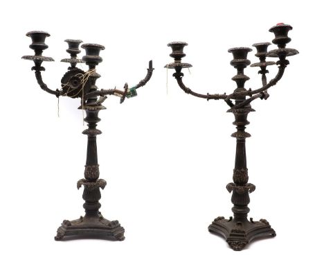 A large pair of three-branch silver plated candelabra,in the manner of Matthew Boulton, the three scroll arms over a tapering