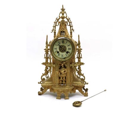 An early 20th century French gilt metal mantel clock,the enamel dial with Roman numerals and minute track, the single-chain m