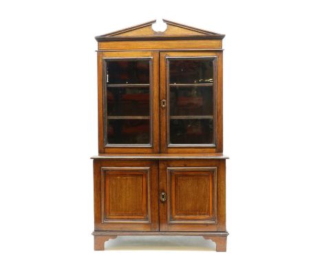 A George III-style walnut and satinwood strung miniature bookcase,late 19th century, with a broken swan neck pediment over a 