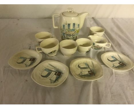 A stylish 1960s ceramic coffee set, comprising a coffee pot, milk jug and sugar bowl; together with four cups and saucers