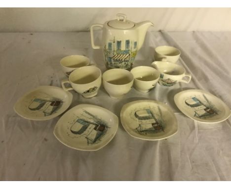 A stylish 1960s ceramic coffee set, comprising a coffee pot, milk jug and sugar bowl; together with four cups and saucers