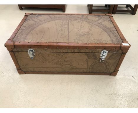 A modern trunk decorated with a map of the world.