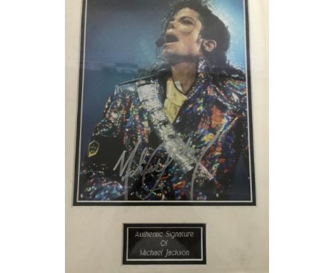A framed and glazed signed photograph of Michael Jackson (with COA)