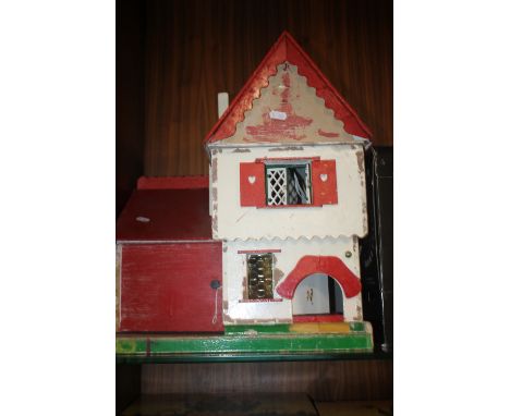 A VINTAGE WOODEN DOLLS HOUSE AND GARAGE