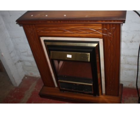 AN ELECTRIC FIRE WITH SURROUND