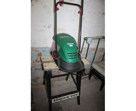 A QUALCAST ELECTRIC MOWER AND WORKMATE BENCH