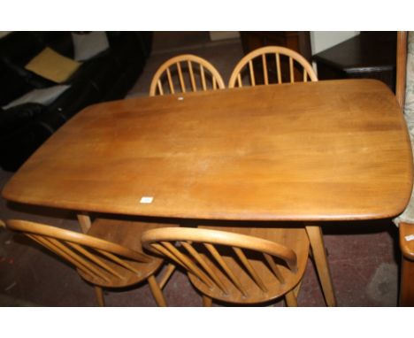 AN ERCOL DINING TABLE WITH FOUR CHAIRS
