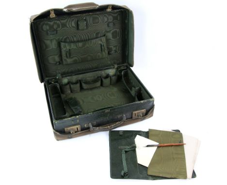 A Harrods Ltd leather dressing case with green silk lined interior fitted with various compartments to take bottles etc (cont