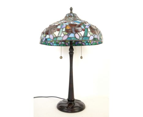 Modern Tiffany style table lamp, the stained glass forming flowers and berries.     