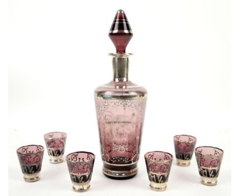 Amethyst glass decanter and six glasses .     