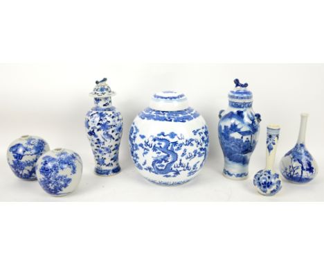 Seven blue and white vases, including: two Chinese vases, each with a Kangxi four-character mark on the base, though neither 