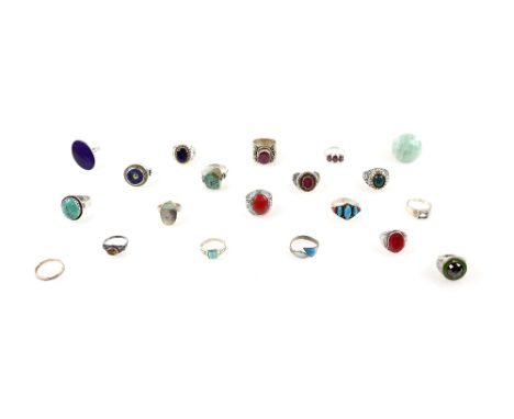 Twenty rings, mainly in silver, including lapis lazuli ring, size R, synthetic ruby ring, four turquoise rings and other plai