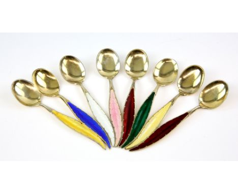 Set of eight Swedish silver and enamel feather design spoons .     