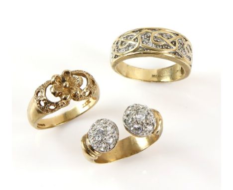 Three vintage rings, one diamond set band, another cubic zirconia set torque design, both size U and floral dress ring, size 