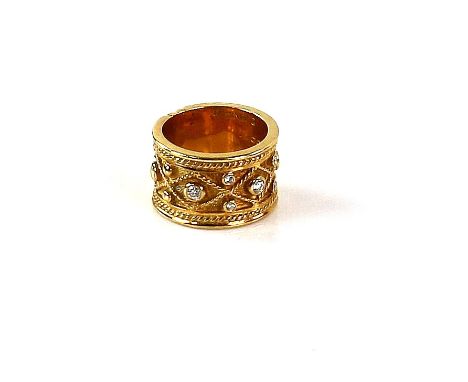 Gold Etruscan style ring set with diamonds and beaded decoration within a rope twist border, signed by Yanes Madrid, marks fo