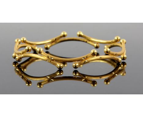 Gold bangle, made up of a series of curved sections with spherical terminations, brushed finish, testing as 22 ct .     CONDI