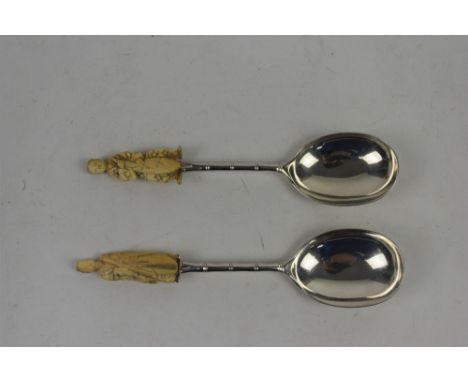 Victorian pair of silver serving spoons, each with bamboo design stems and ivory figural finials, by Atkin Brothers, Sheffiel