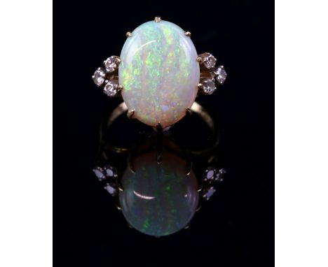 Vintage opal and diamond dress ring, centrally set oval cabochon cut opal, 15 x 12mm, set in-between six round brilliant cut 