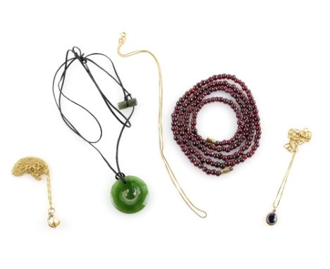 A mixed group of items, including oval cut sapphire pendant, three chains, all in 9 ct, with a garnet bead necklace, green ha