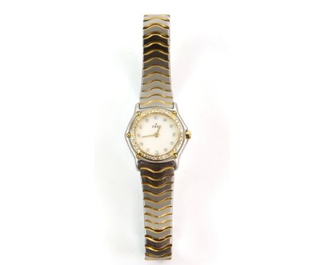Ebel Reference 1057902 Ladies wristwatch with18ct yellow gold and diamond set bezel, surmounted  by 5 screws, the white dial 