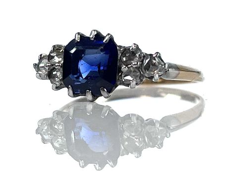 An early 20th century gold and platinum diamond and sapphire seven stone ring, the square octagon cut sapphire measuring 1.6c