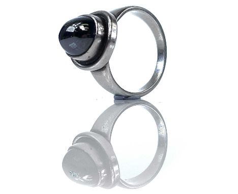 A Georg Jensen silver and hematite ring, no.46B, set with hematite cabochon, stamped marks, size Q.