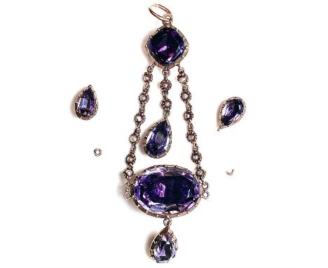 A Georgian amethyst and seed pearl drop pendant, the amethyst stones foil backed, the large oval amethyst measuring 10mm x 15