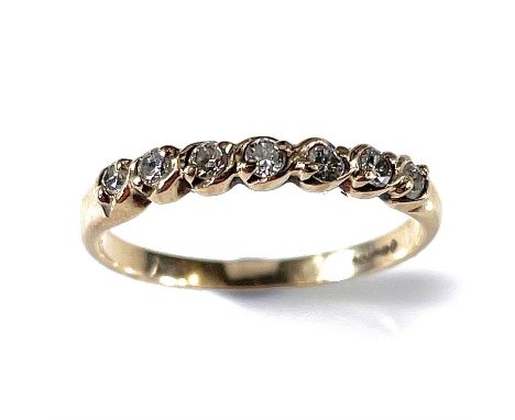 A 9ct hallmarked gold diamond set seven stone ring, the diamonds each measure 0.04ct, size Q/R, weight 1.78g.