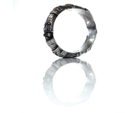 A stylish Finnish silver hollow hinged bangle, embossed with geometric design and hands, stamped marks and makers name IIVES,