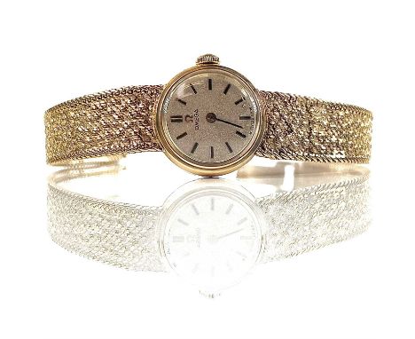 An Omega 9ct gold ladies manual wind bracelet watch, cal. 485, London 1972, with original box, weight 15.65g.This watch winds