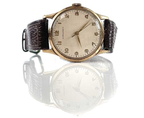 A 1960's Longines 9ct gentleman's manual wind wristwatch, ref. 30LS, the signed cream 28mm dial with gilt Arabic numerals, th