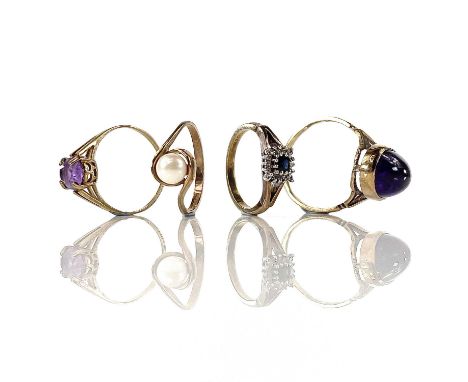 A 9ct diamond and sapphire cluster ring, size J/K; together with three other 9ct stone set rings, weight overall 8.79g.