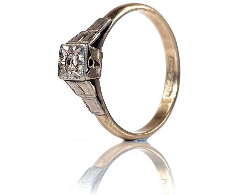 A 9ct and platinum single small diamond set ring, size O, weight 2.15g.