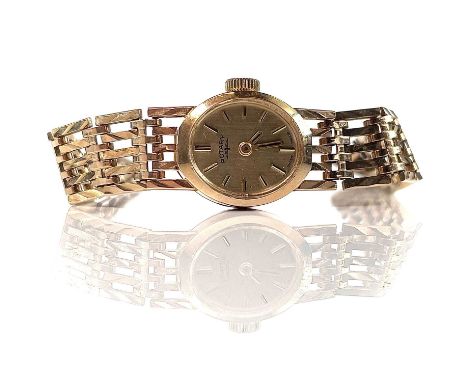 A Rotary 9ct ladies manual wind bracelet wristwatch, the 13mm width gilt dial signed and with gilt baton markers, the 17 jewe