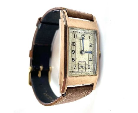 A 1930's 9ct gentleman's manual wind wristwatch, the rectangular silvered 20mm width dial with Arabic numerals and subsidery 