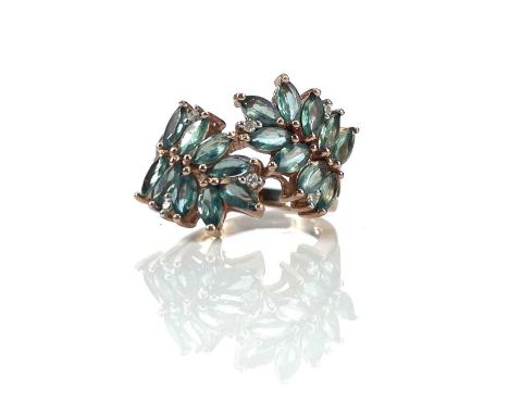 A good 14k rose gold Alexandrite and diamond set ring, the 18 marquise cut Brazilian Alexandrite's with a combined weight of 