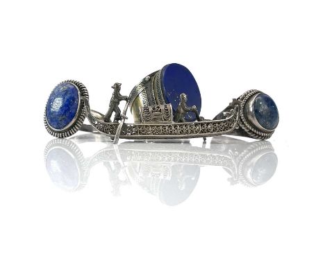 A Persian silver and gilt filigree Lapis Lazuli set ring, together with two other silver Lapis lazuli rings and a filigree mi